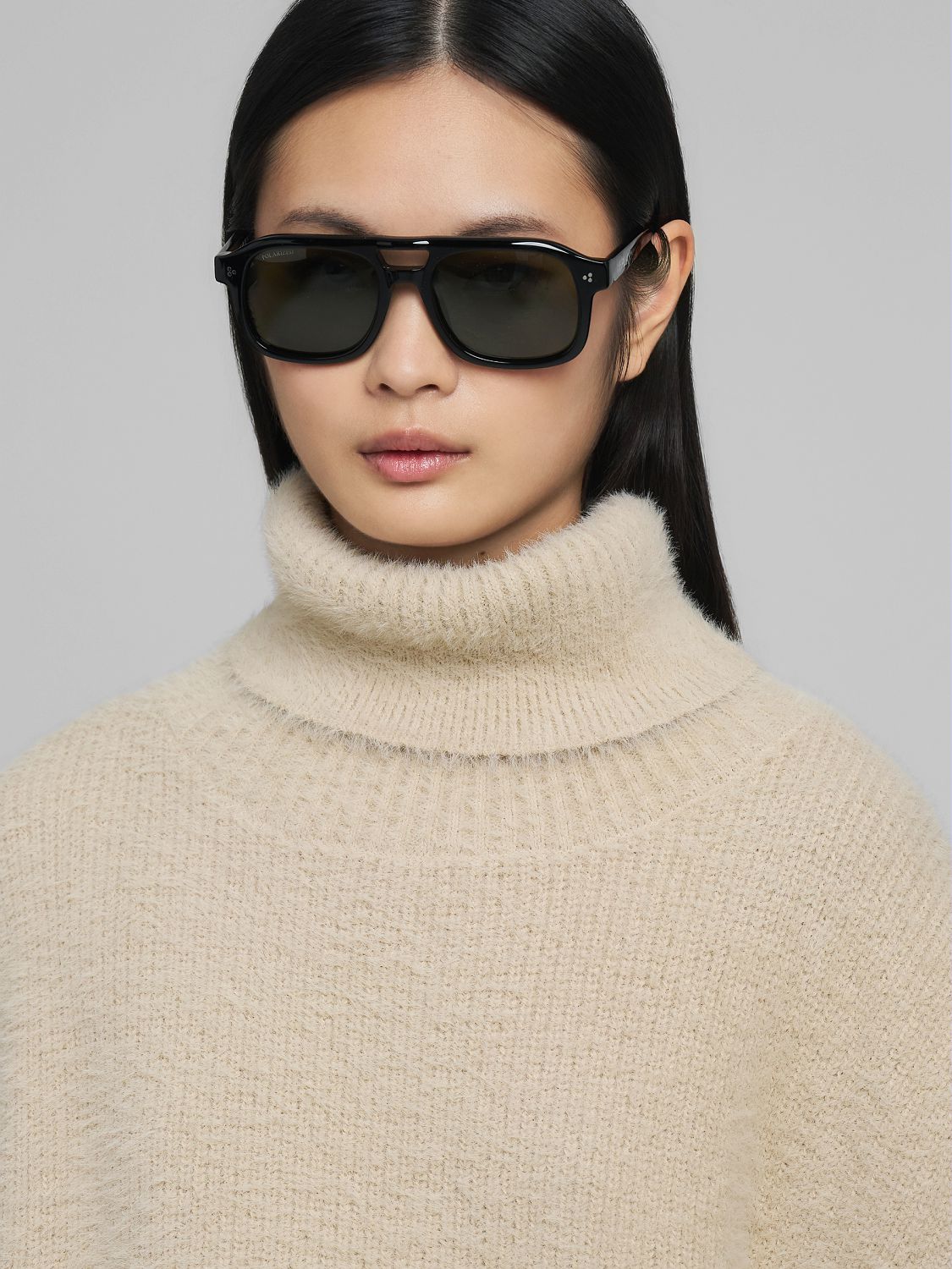 Chlupatý svetr bez rukávů