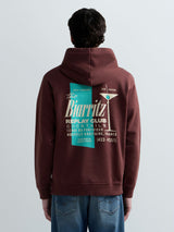 PÁNSKÁ MIKINA S KAPUCÍ A POTISKEM "THE BIARRITZ REPLAY CLUB" NA ZÁDECH