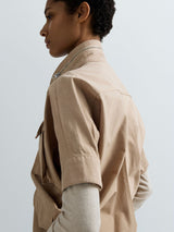 DÁMSKÁ BUNDA S KRÁTKÝM RUKÁVEM A KAPSAMI