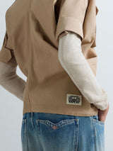 DÁMSKÁ BUNDA S KRÁTKÝM RUKÁVEM A KAPSAMI